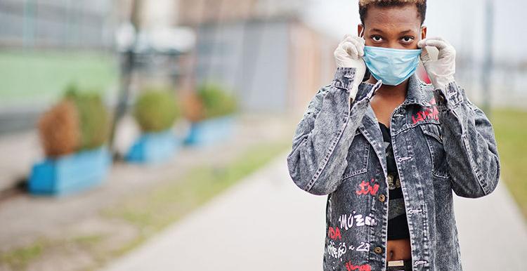 Black teenager in mask