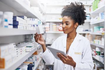 Pharmacist checking medication