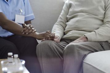 Nurse comforting patient